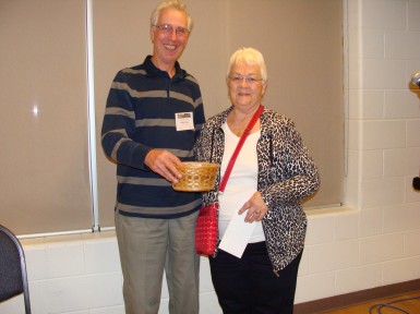 Lois Frederikse, shown with Chapter volunteer Hugh Cass,  won $95 